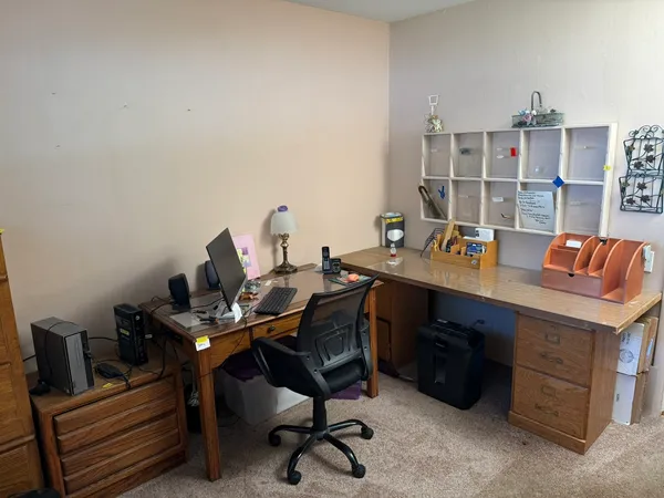 a view of a workspace with furniture