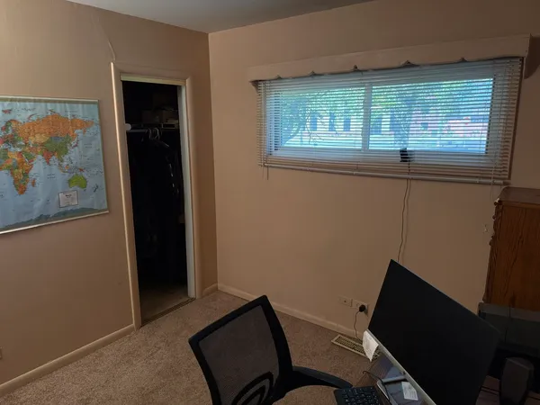 a view of a room with furniture and a window
