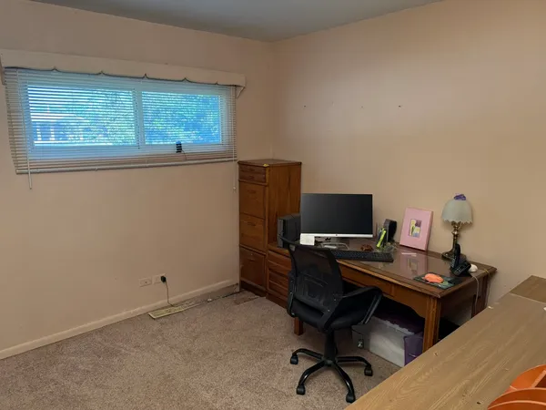 a view of a workspace with furniture