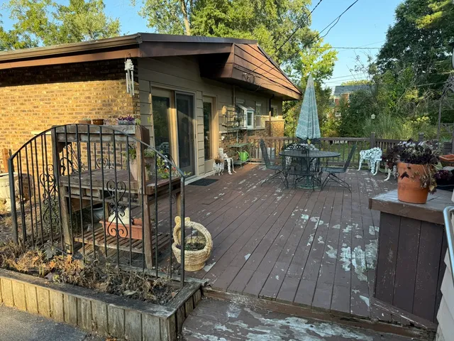 a view of a chairs and table in the balcony