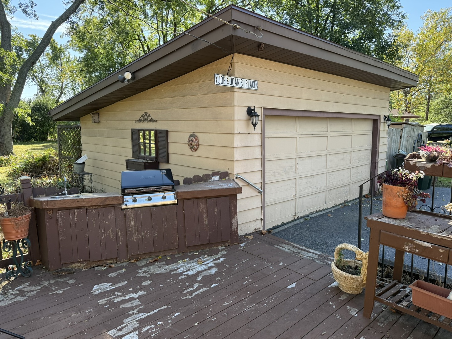 1901 West Plainfield Road La Grange Highlands, IL 60525 - Photo 28 of 37 a backyard of a house with barbeque oven and outdoor seating