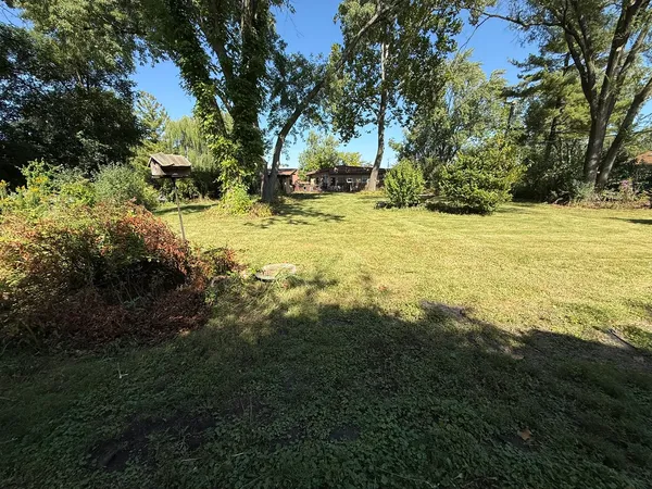 a view of a yard with an outdoor space