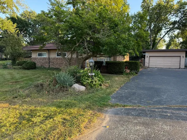 a view of a couches in backyard of house
