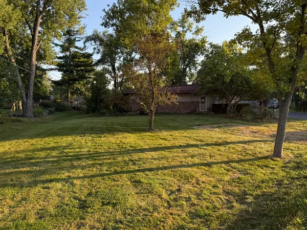 a view of a swimming pool with a house