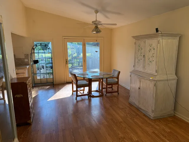 a view of a livingroom with furniture and wooden floor