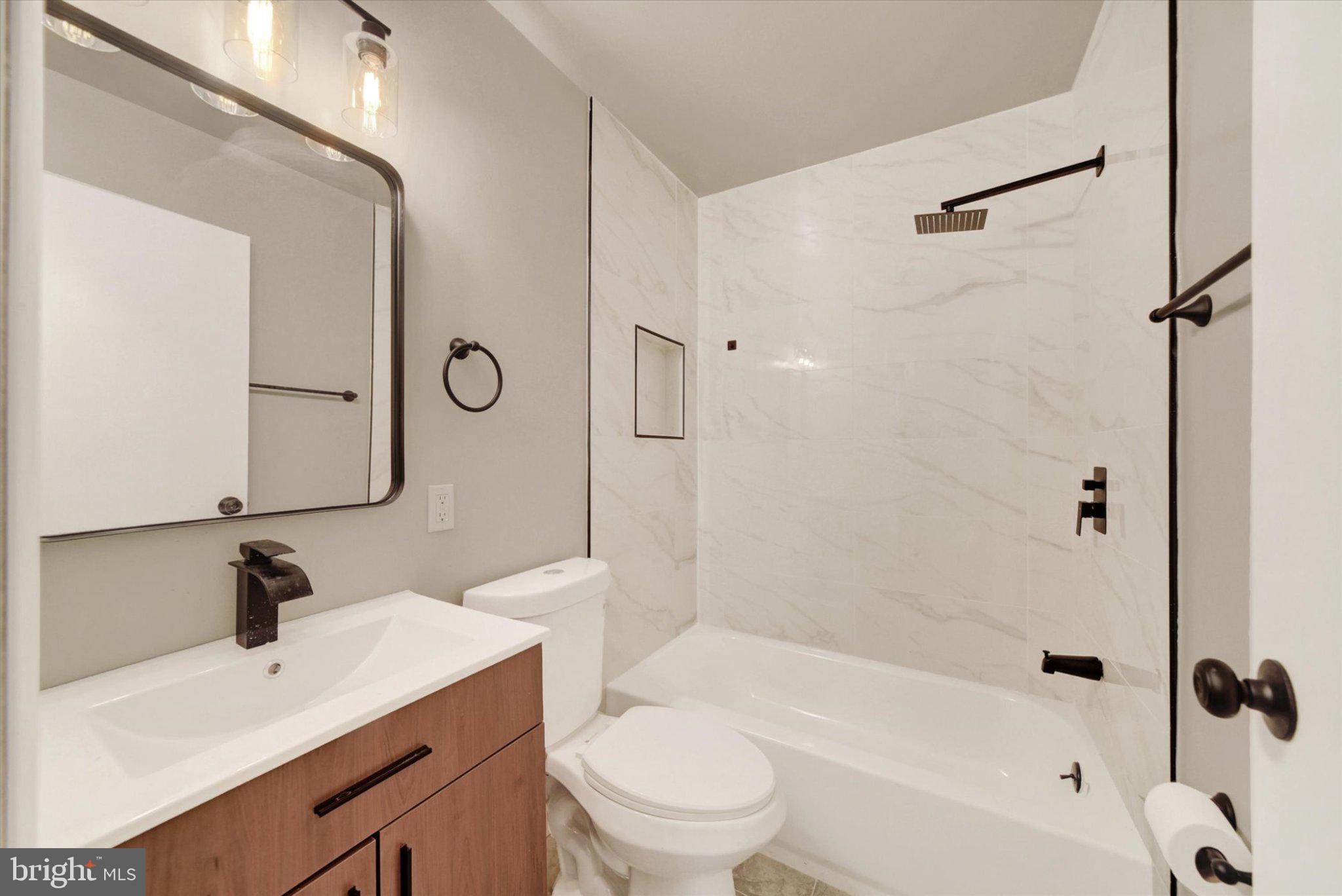 3709 Lamoine Road Randallstown, MD 21133 - Photo 12 of 25 Sleek modern bathroom retreat.