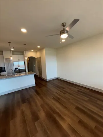 a view of a kitchen with a sink and a floor to ceiling window