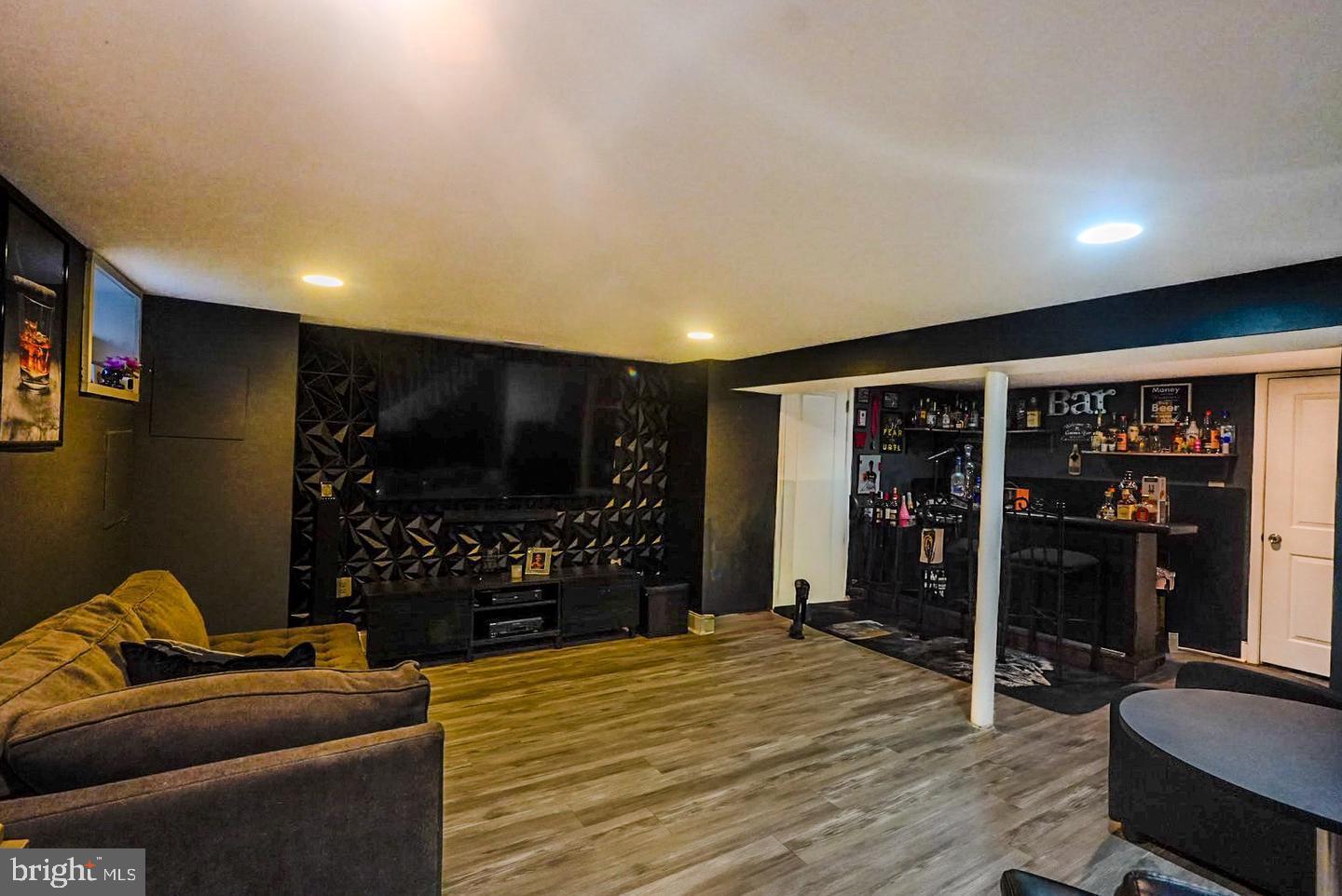 3915 Flowerton Road Baltimore, MD 21229 - Photo 12 of 15 a room with furniture and a flat screen tv