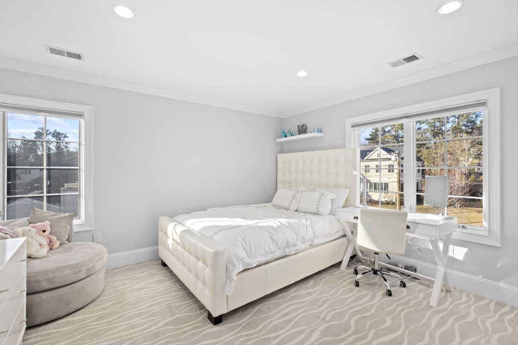 37 Columbine Road Newton, MA 02459 - Photo 23 of 40 a bedroom with a bed wooden floor and windows