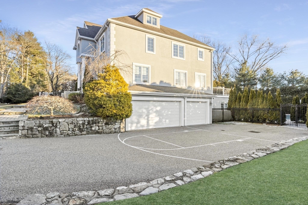 37 Columbine Road Newton, MA 02459 - Photo 36 of 40 a front view of a house with a yard and garage