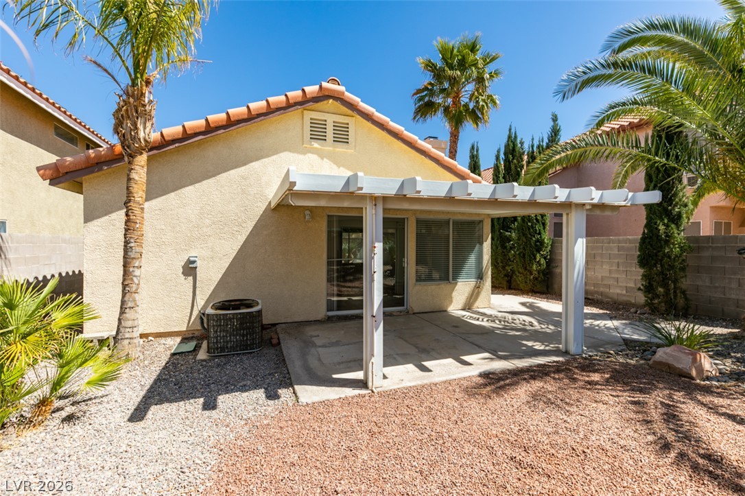 307 Cavalla Street Henderson, NV 89074 - Photo 42 of 44 A spacious covered patio provides an ideal spot for outdoor enjoyment, overlooking the xeriscape landscaping.