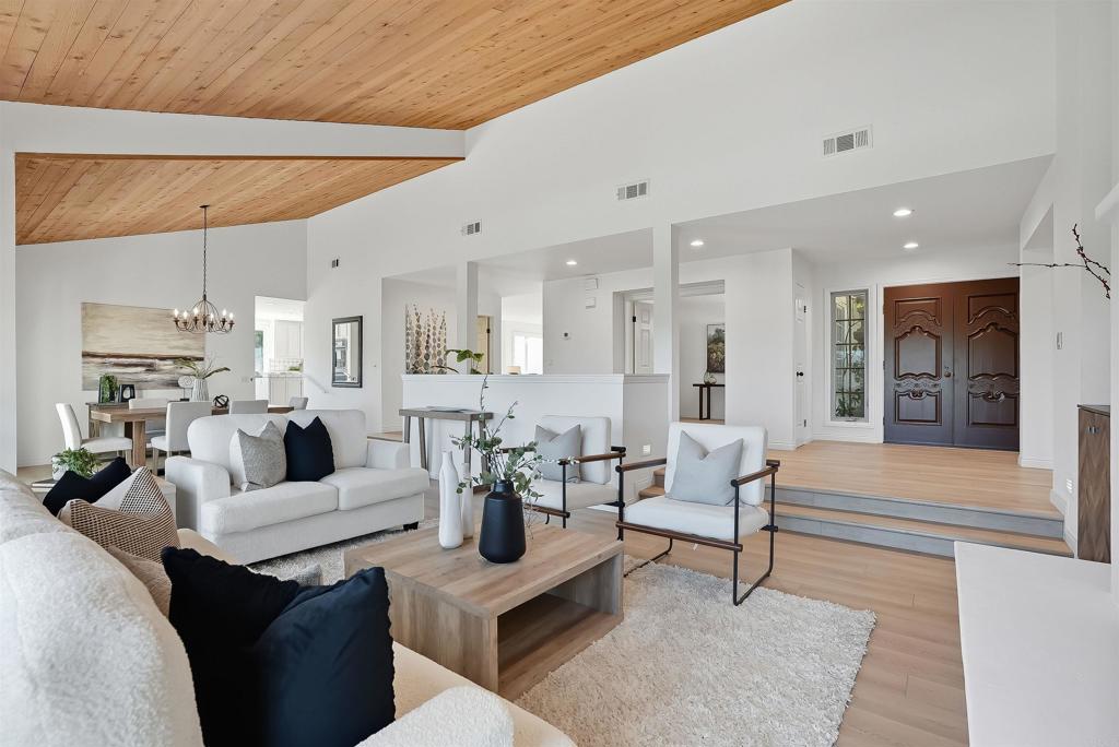 2206 Running Spring Place Encinitas, CA 92024 - Photo 13 of 44 a living room with furniture and a view of kitchen
