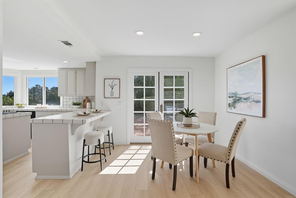 2206 Running Spring Place Encinitas, CA 92024 - Photo 17 of 44 a dining room with furniture and window