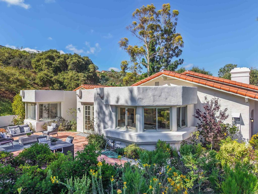 2206 Running Spring Place Encinitas, CA 92024 - Photo 2 of 44 a front view of a house with a garden