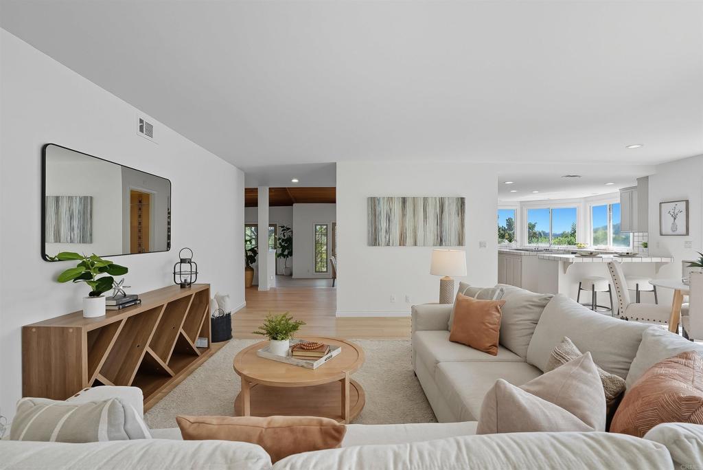 2206 Running Spring Place Encinitas, CA 92024 - Photo 21 of 44 a living room with furniture and wooden floor