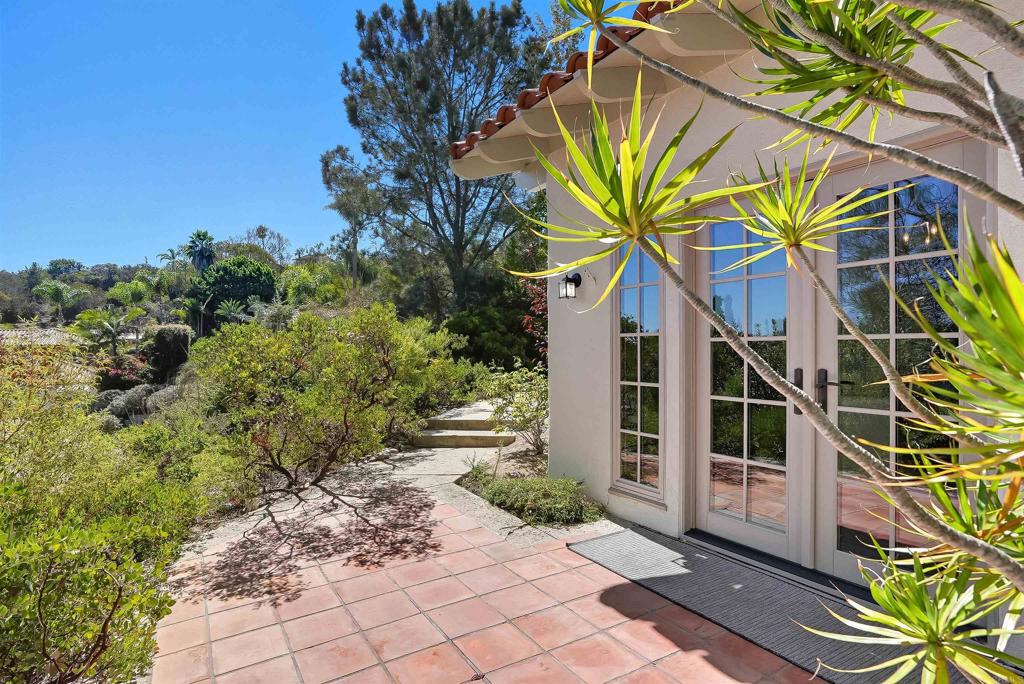 2206 Running Spring Place Encinitas, CA 92024 - Photo 41 of 44 a view of a house with a small yard and large trees