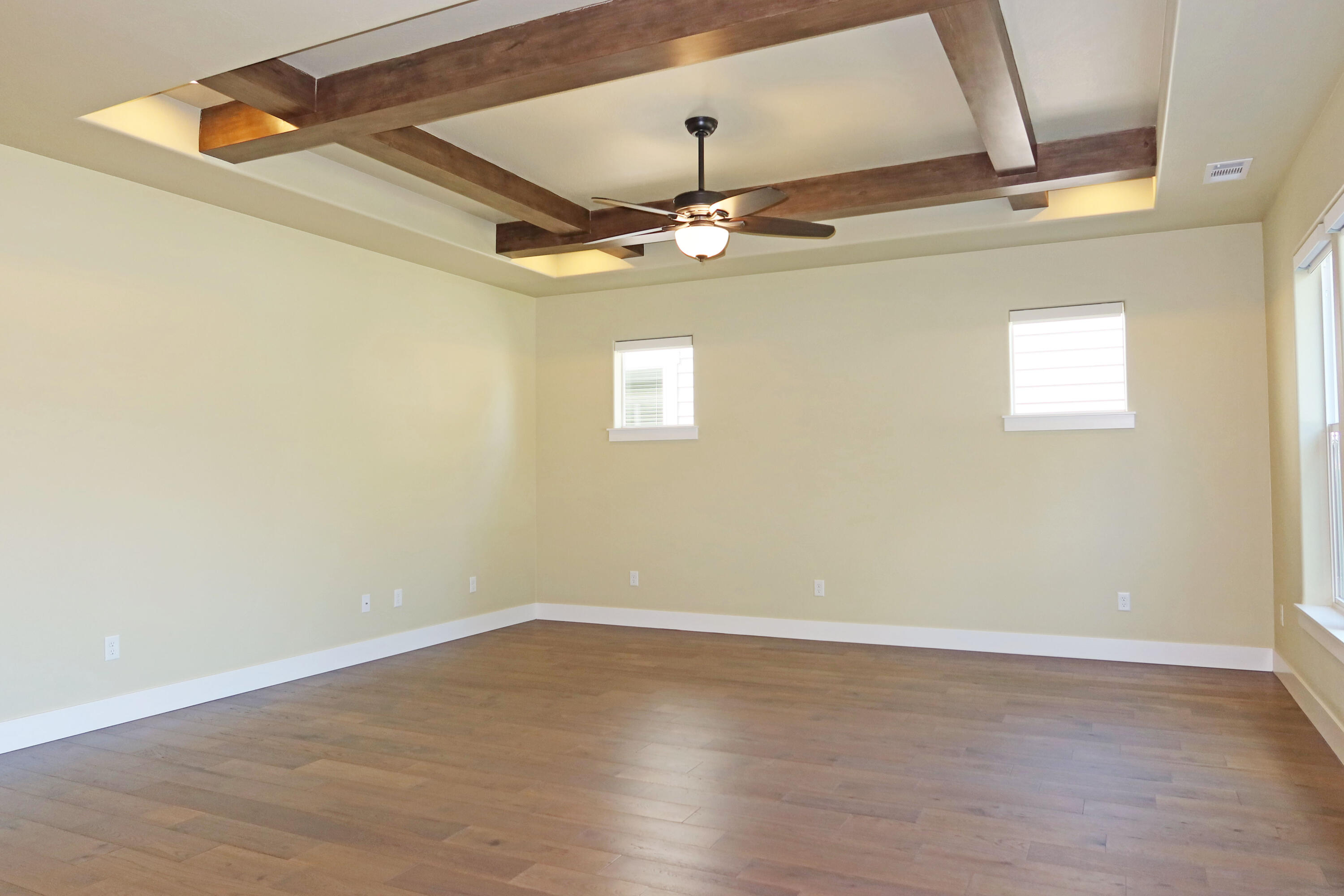 656 Aspen Street Springfield, OR 97477 - Photo 26 of 29 an empty room with wooden floor ceiling fan and window