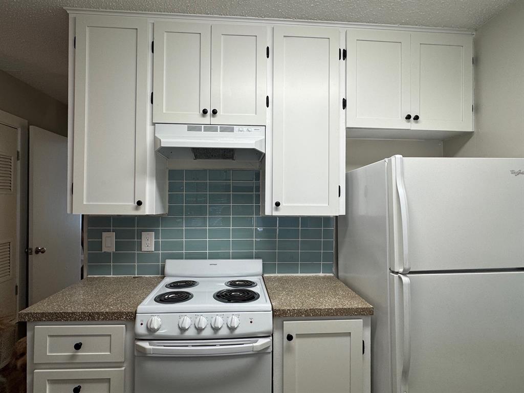 2408 Longview Street, Unit 108 Austin, TX 78705 - Photo 5 of 7 a kitchen with appliances and cabinets