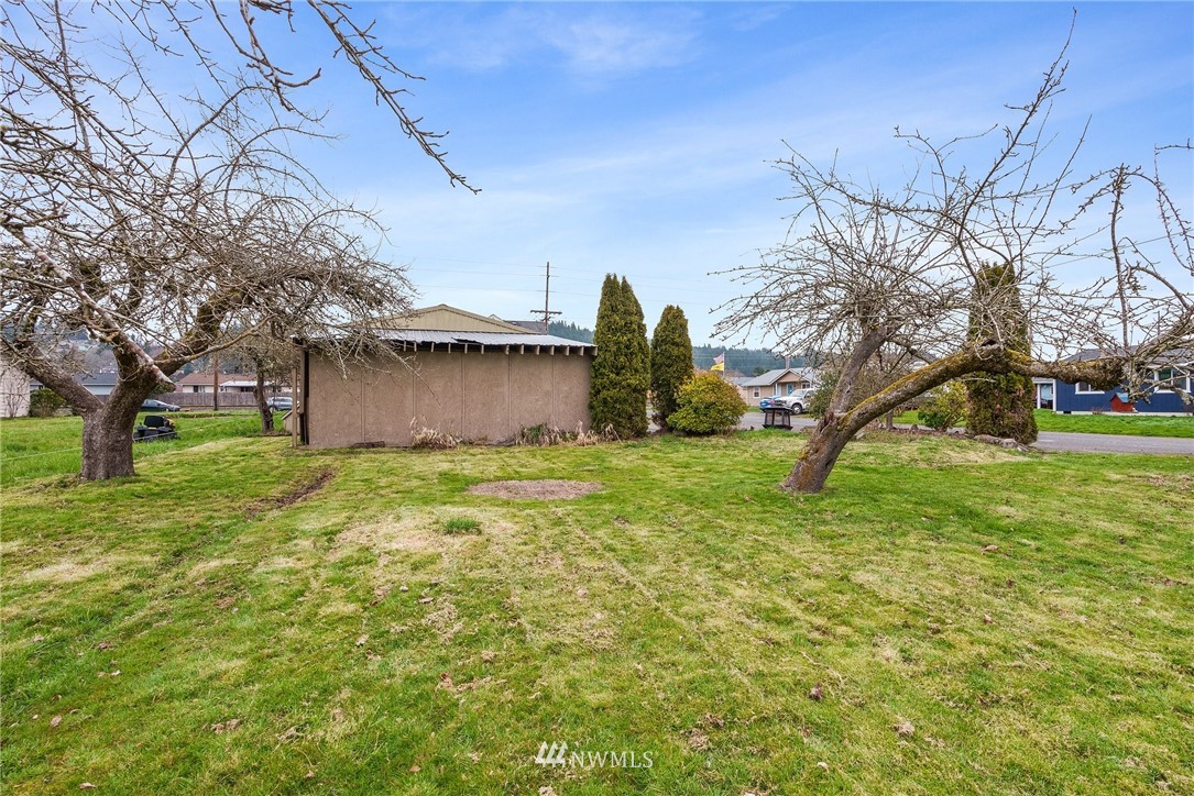 579 Southwest Pacific Avenue Chehalis, WA 98532 - Photo 23 of 24 a view of a house with a yard
