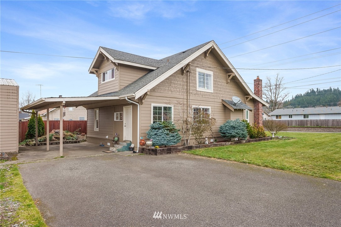 579 Southwest Pacific Avenue Chehalis, WA 98532 - Photo 3 of 24 a view of a house with a yard and sitting area