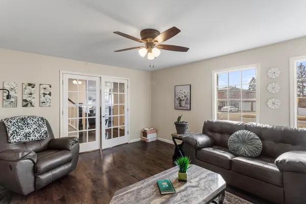 a living room with furniture and a large window