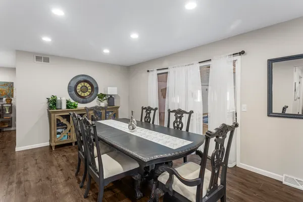 a view of a dining room with furniture and window