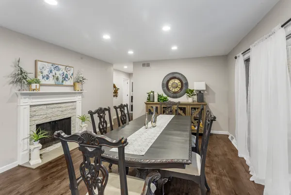 a view of a livingroom with furniture and a fireplace