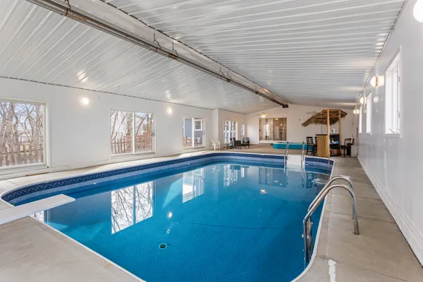 a view of swimming pool with outdoor seating