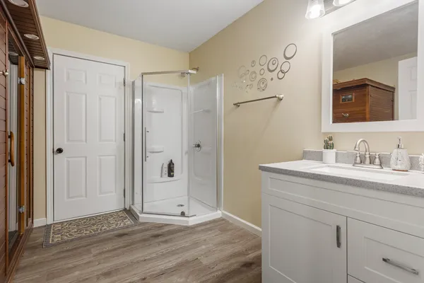 a bathroom with a granite countertop sink mirror and double