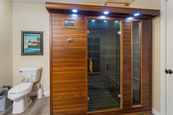 a bathroom with a toilet and shower