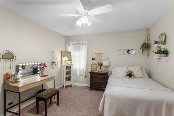 a bedroom with a bed and furniture