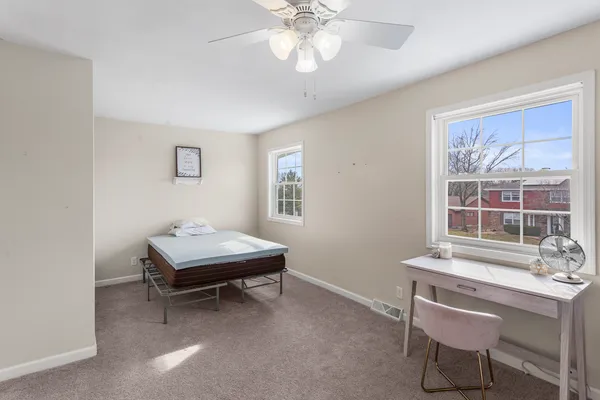 a room with a table and windows