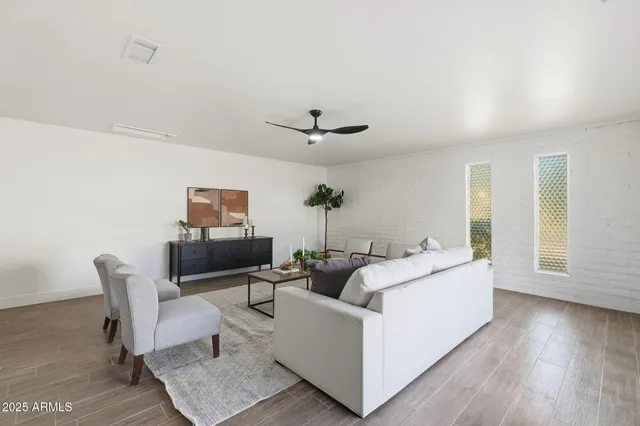 a kitchen with stainless steel appliances a stove sink microwave and cabinets