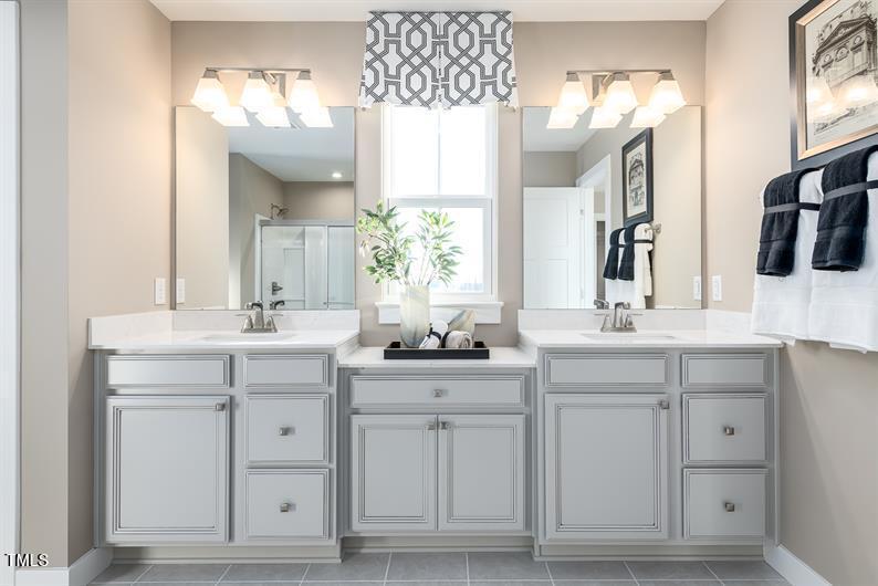 548 Impala Trace Wendell, NC 27591 - Photo 7 of 10 a bathroom with double sink and a mirror