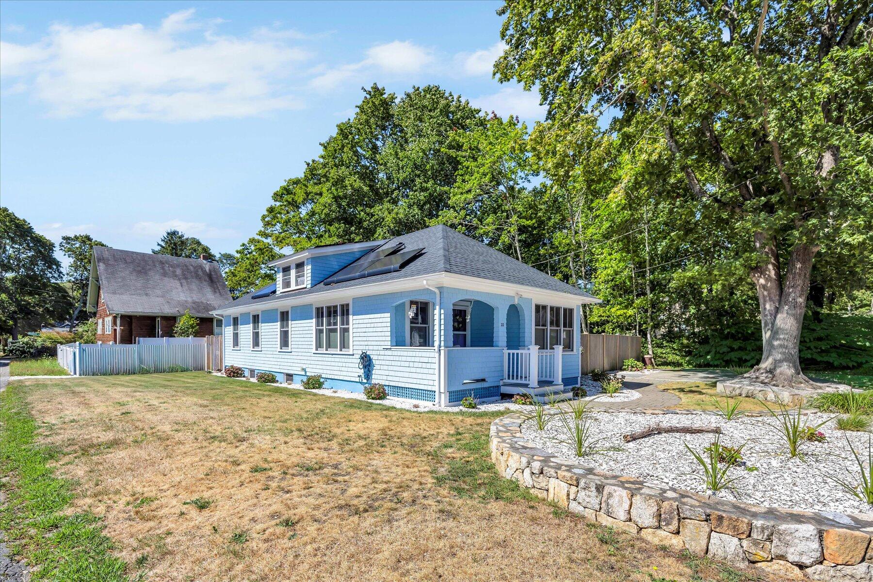 22 Bay View Avenue Buzzards Bay, MA 02532 - Photo 1 of 42 a front view of a house with a yard and trees