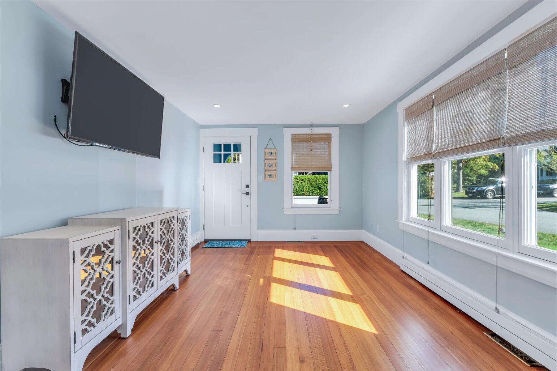 22 Bay View Avenue Buzzards Bay, MA 02532 - Photo 16 of 42 a view of an empty room with a window and wooden floor