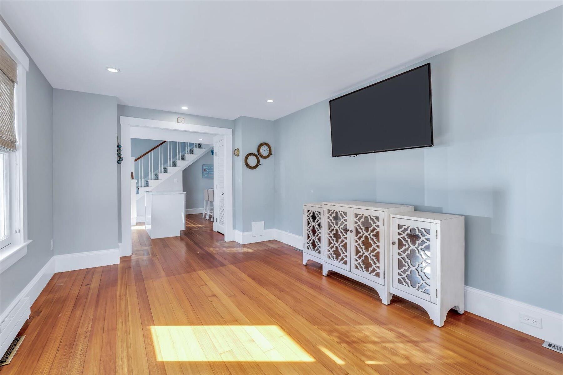 22 Bay View Avenue Buzzards Bay, MA 02532 - Photo 17 of 42 a view of a livingroom with wooden floor and a flat screen tv