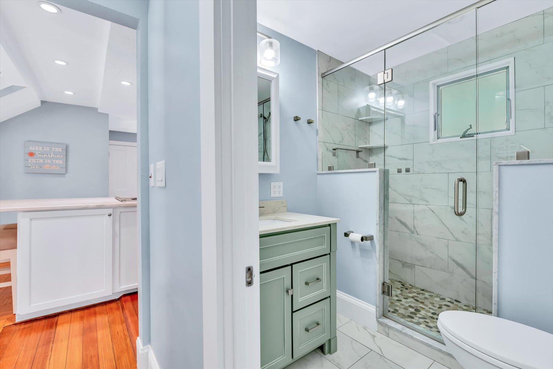 22 Bay View Avenue Buzzards Bay, MA 02532 - Photo 18 of 42 a bathroom with a granite countertop sink a toilet and shower