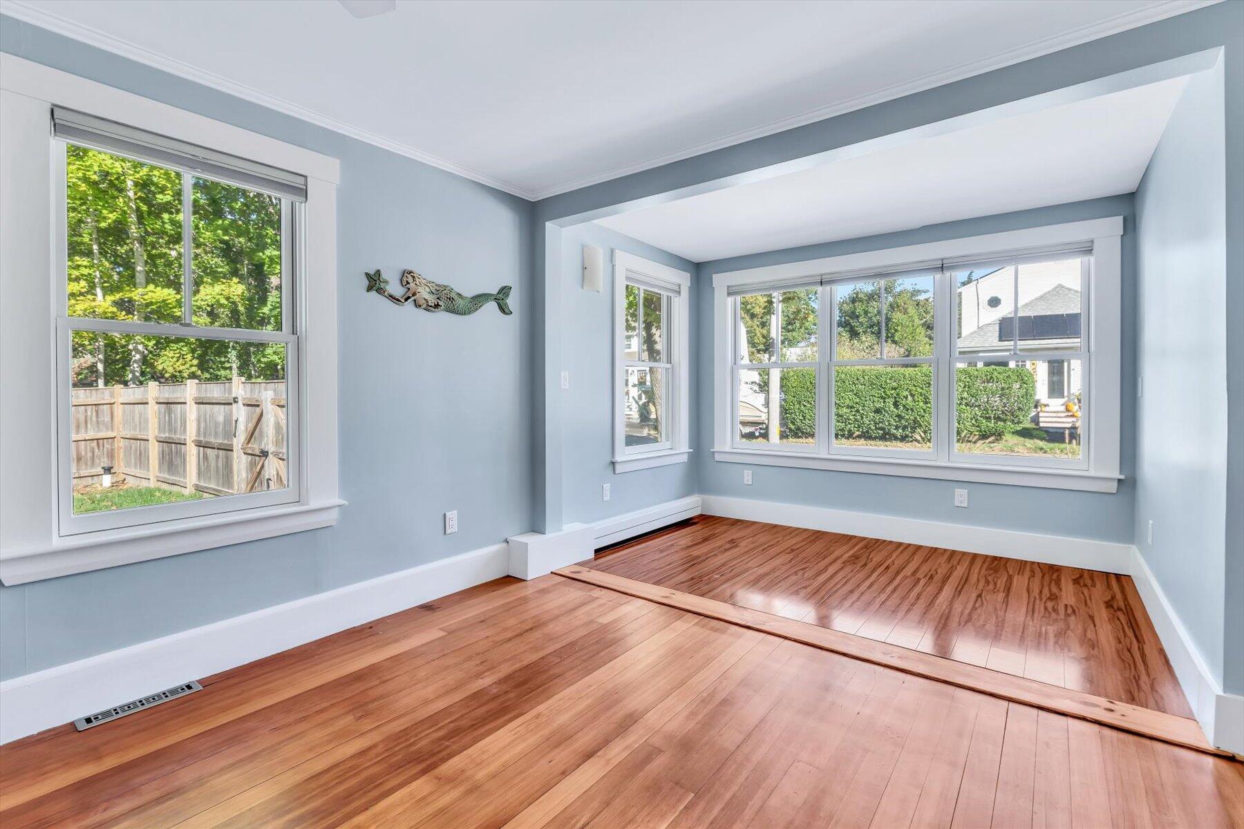 22 Bay View Avenue Buzzards Bay, MA 02532 - Photo 20 of 42 a view of an empty room with wooden floor and a window