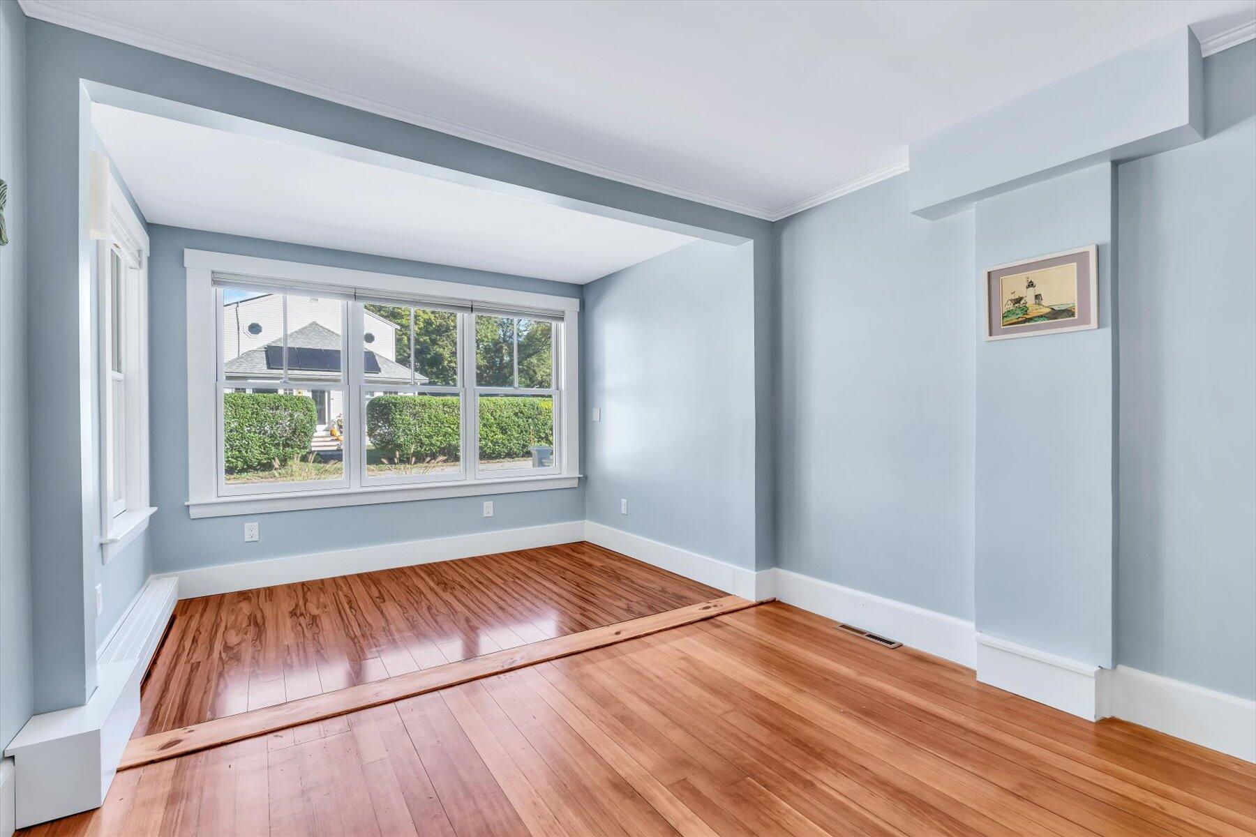 22 Bay View Avenue Buzzards Bay, MA 02532 - Photo 21 of 42 a view of an empty room with wooden floor and a window