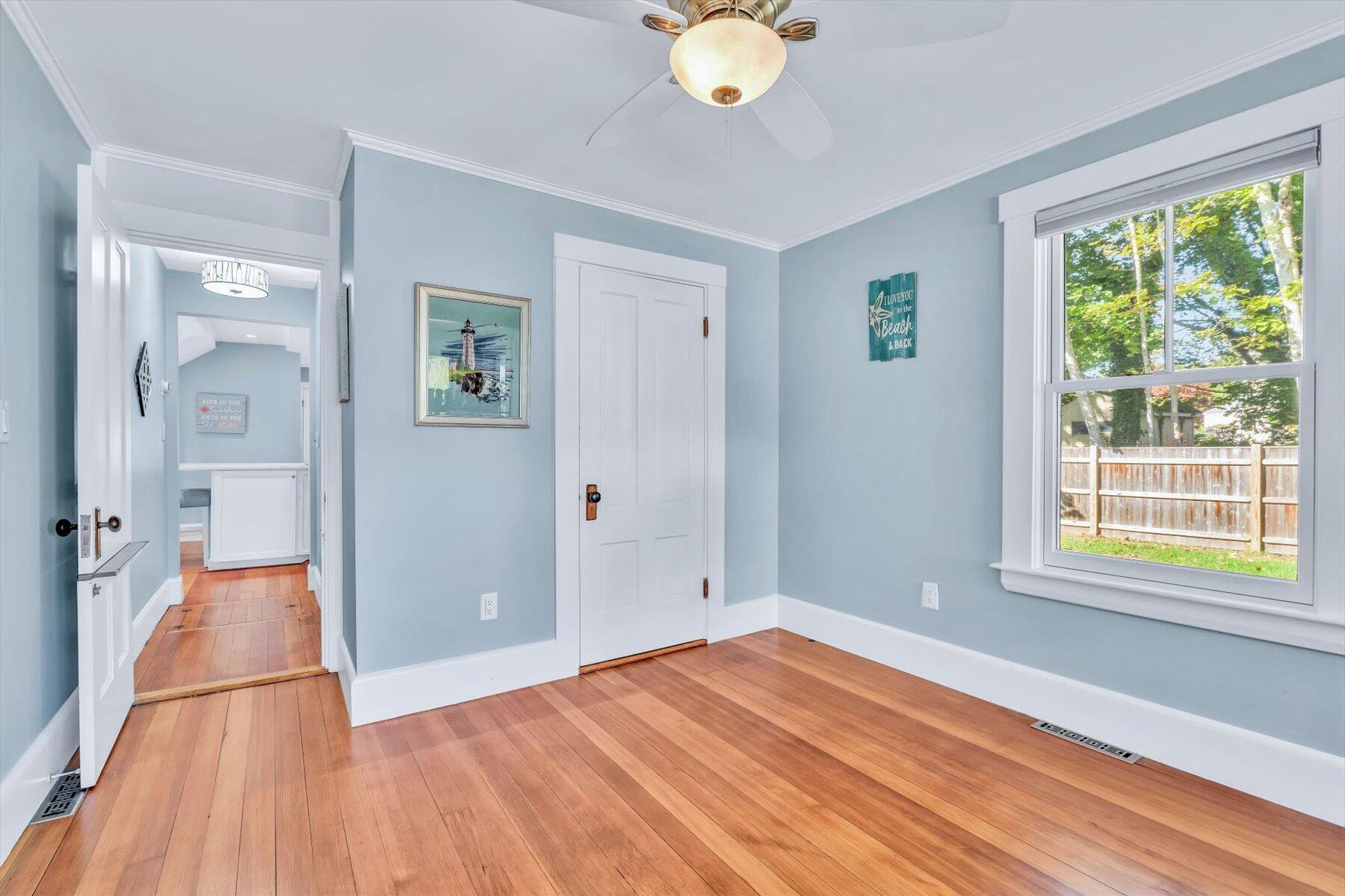 22 Bay View Avenue Buzzards Bay, MA 02532 - Photo 22 of 42 a view of empty room with wooden floor and fan