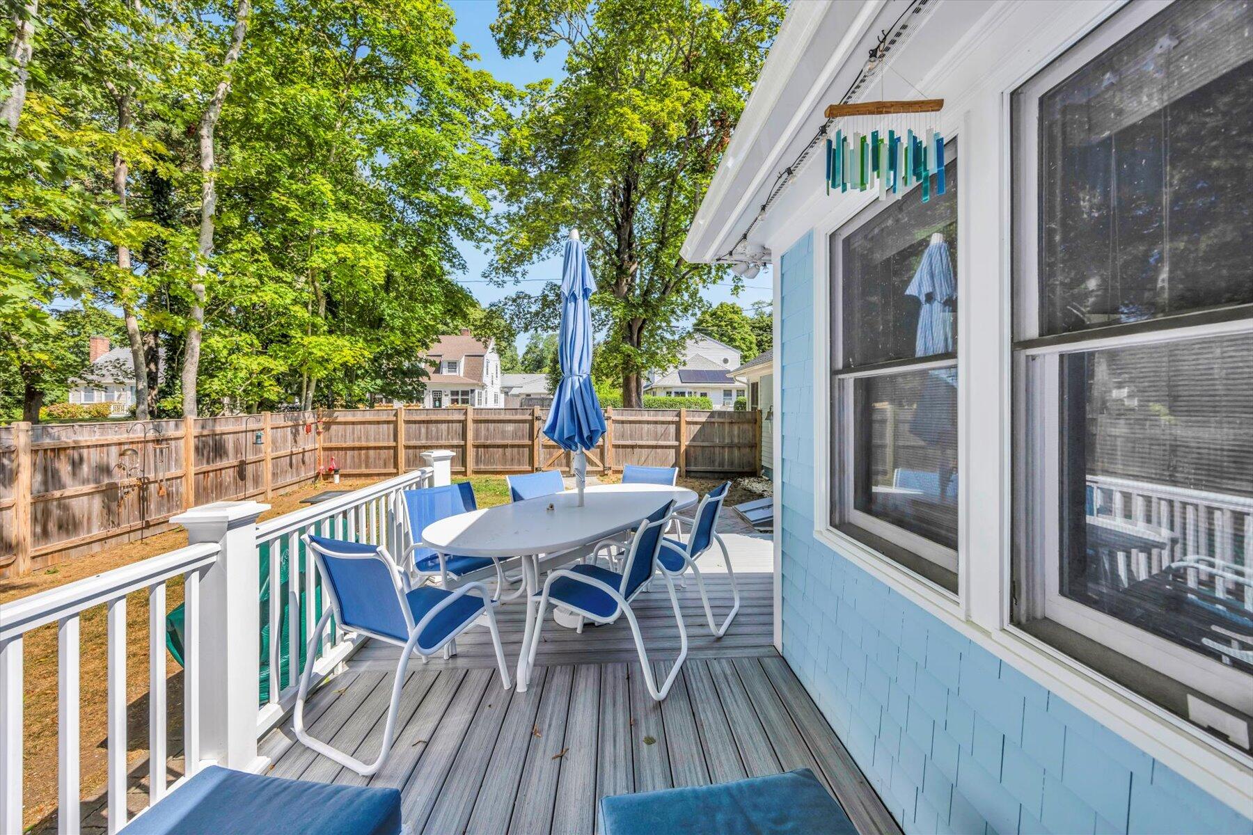 22 Bay View Avenue Buzzards Bay, MA 02532 - Photo 33 of 42 a view of a roof deck with table and chairs and wooden floor
