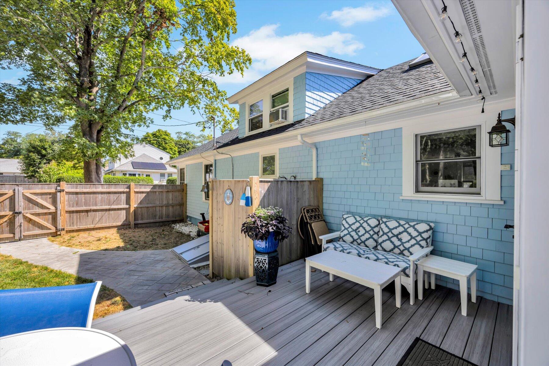 22 Bay View Avenue Buzzards Bay, MA 02532 - Photo 34 of 42 a view of a patio with table and chairs and wooden floor