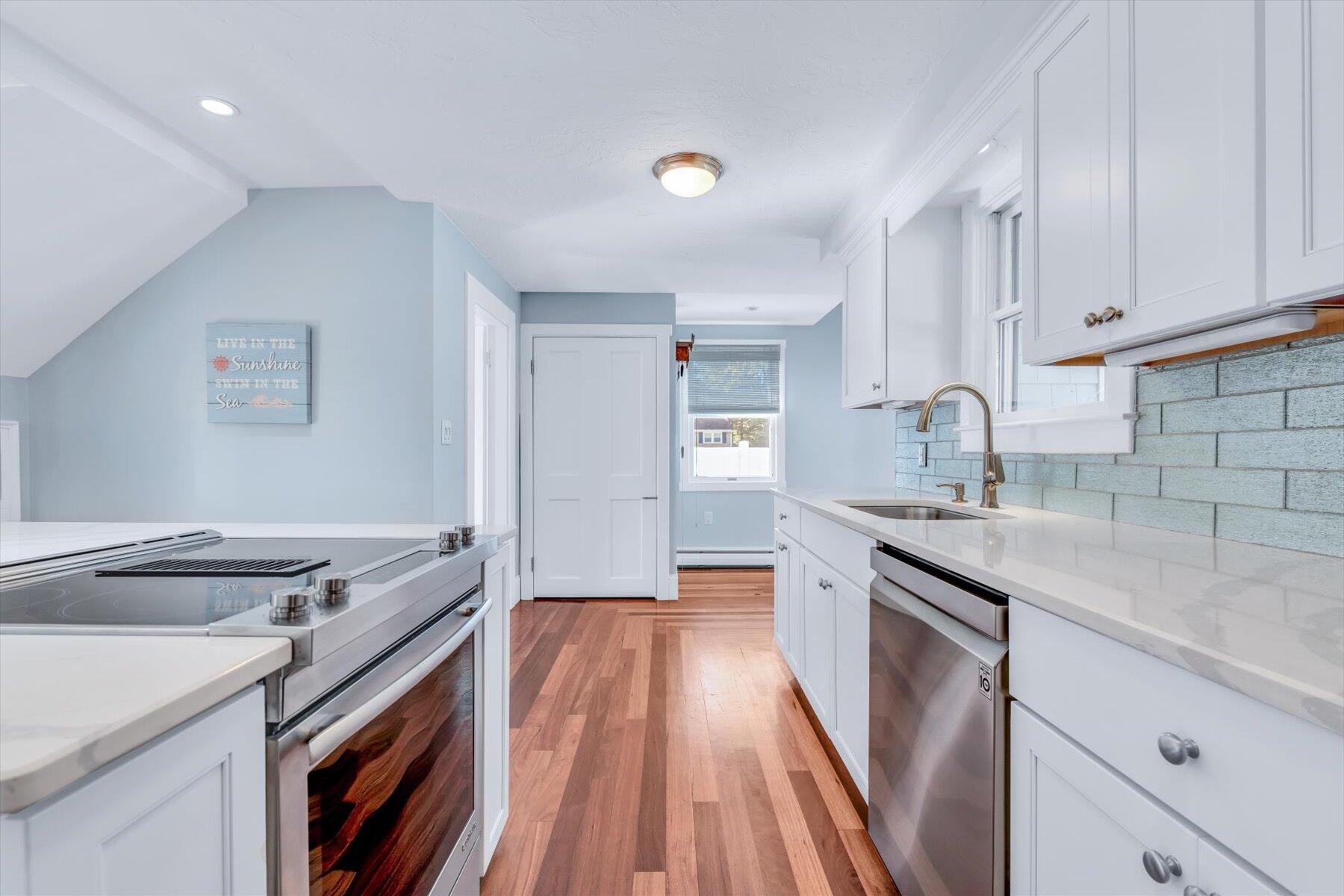 22 Bay View Avenue Buzzards Bay, MA 02532 - Photo 10 of 42 a kitchen with a sink stove and cabinets