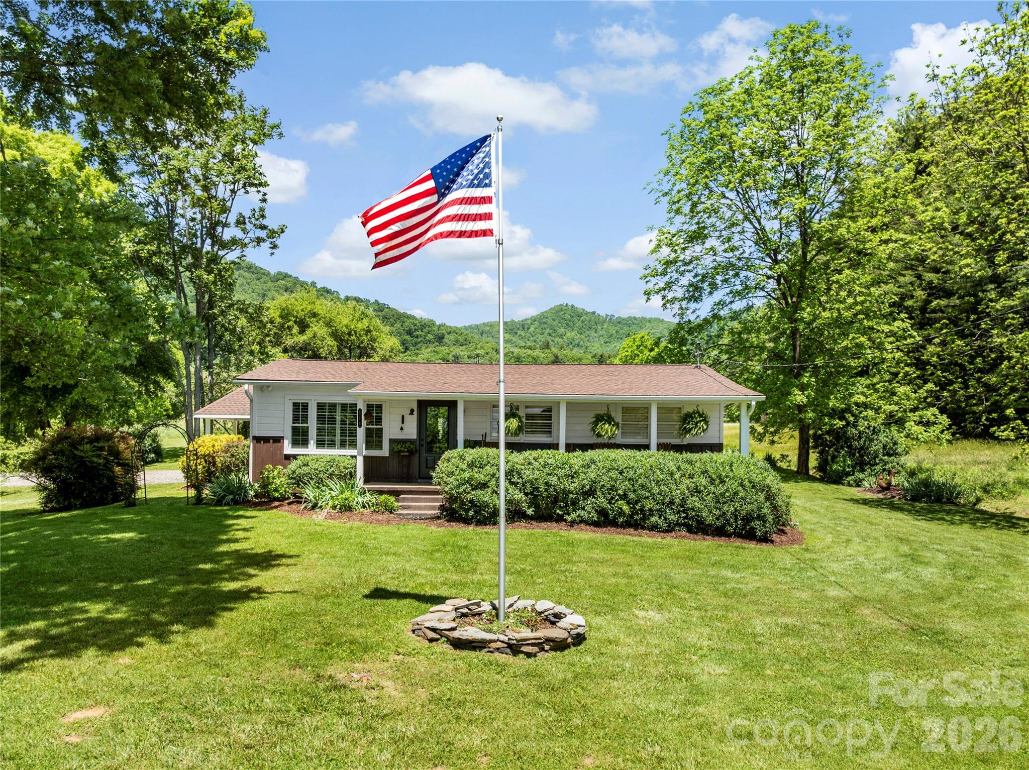 a front view of a house with a yard