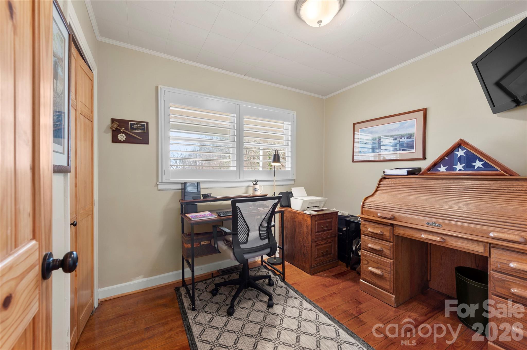 514 Roy Forrester Road Mars Hill, NC 28754 - Photo 11 of 25 a view of a workspace with furniture and a window