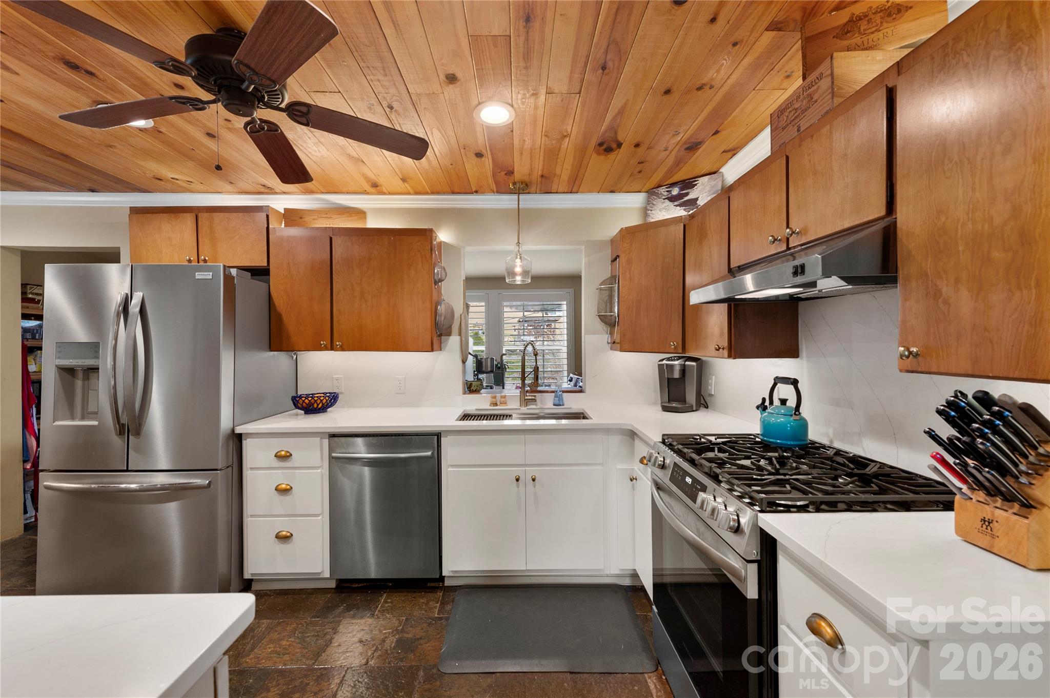 514 Roy Forrester Road Mars Hill, NC 28754 - Photo 12 of 25 a kitchen with stainless steel appliances granite countertop a stove a refrigerator and a sink