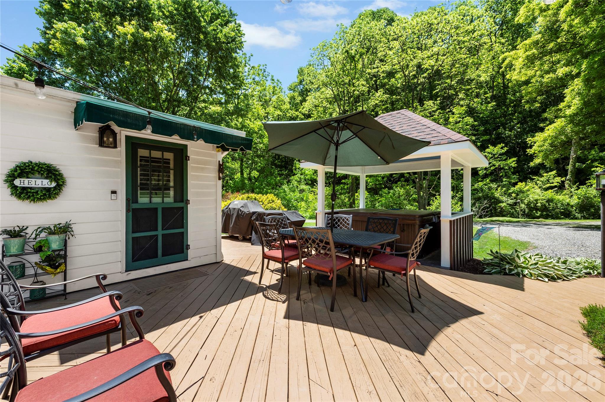 514 Roy Forrester Road Mars Hill, NC 28754 - Photo 18 of 25 a view of a patio with furniture and yard
