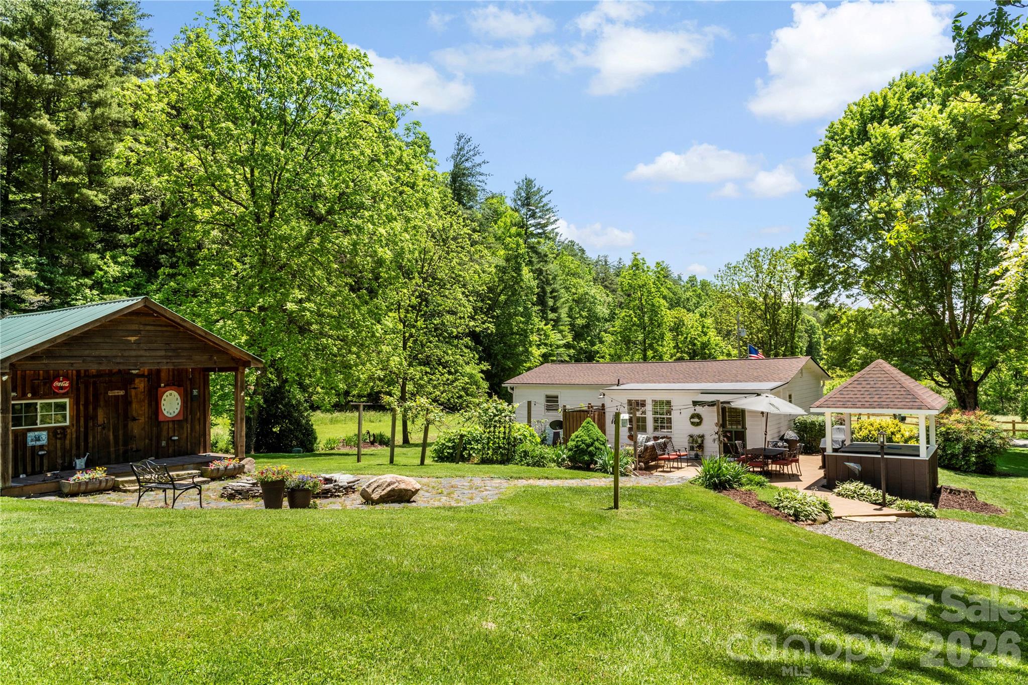 514 Roy Forrester Road Mars Hill, NC 28754 - Photo 19 of 25 a front view of a house with yard and green space