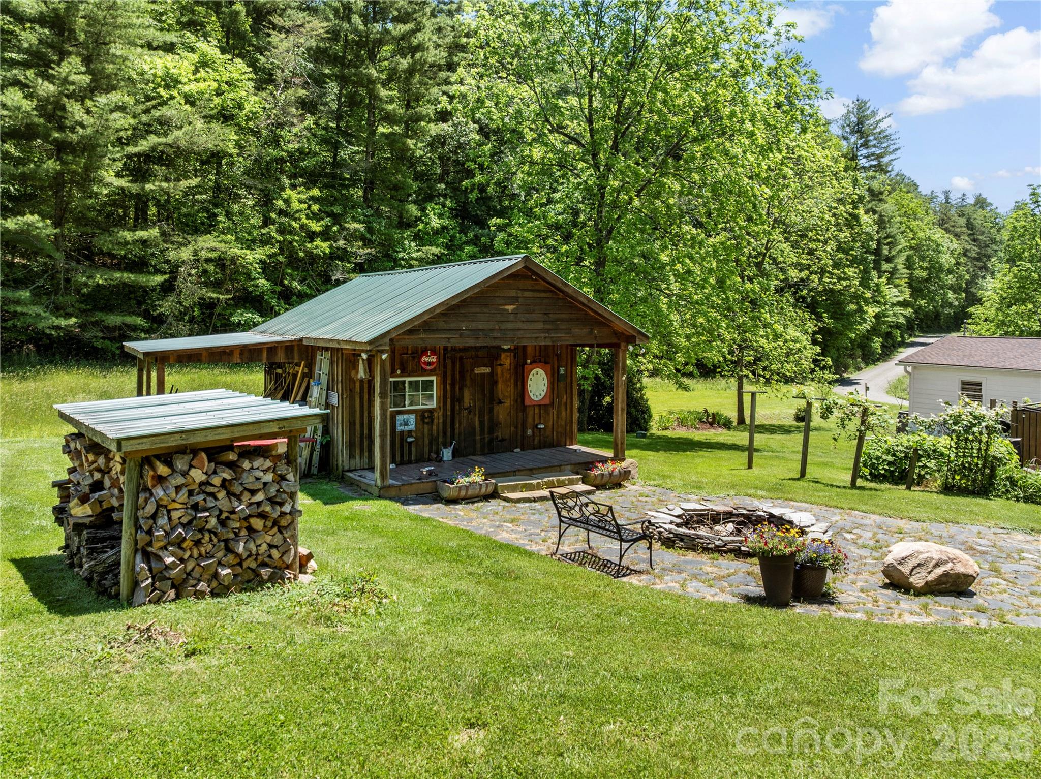 514 Roy Forrester Road Mars Hill, NC 28754 - Photo 20 of 25 a view of a house with backyard porch and sitting area